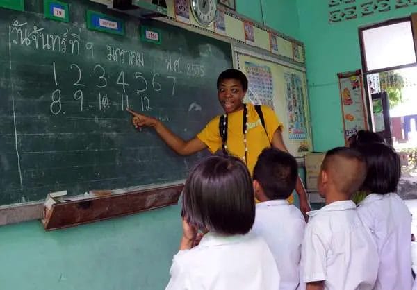 Sailors help teach school kids in Thailand.